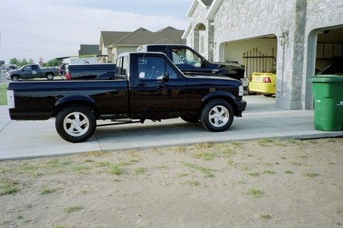 Black 1994 ford f-150 lightning hot rod show truck