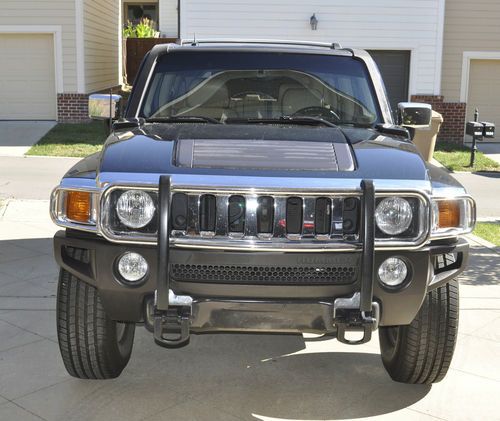 2006 hummer h3 (rear dvd players, plus 3rd row seat in cargo area)