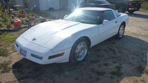 Corvette. auto trans, air, tilt, and cruise. white with red and black interior