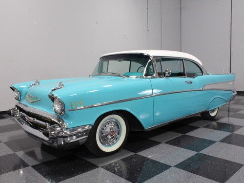 Tropical turquoise, fender skirts, dual-antenna, power windows, ps, wow!