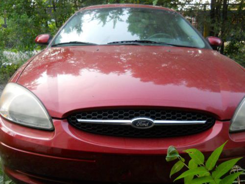 In great running condition red 2000 ford taurus se