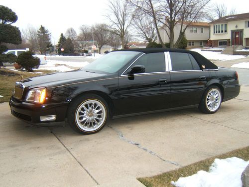 Black cadillac with low miles