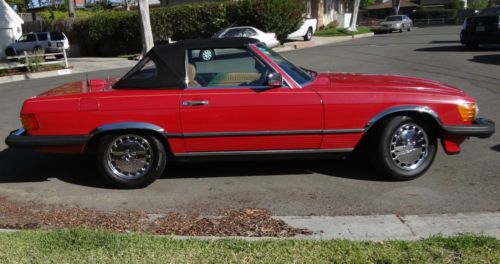 1986 mercedes 560sl. red. with black canvas top convertible 59668 miles