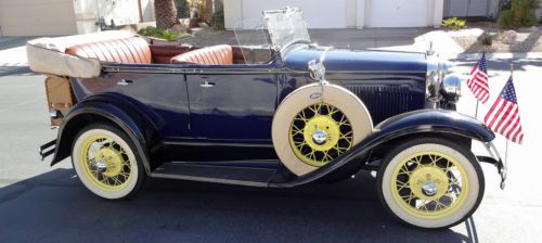 Phaeton restored as original, washington blue with yellow pinstripes, wheels.