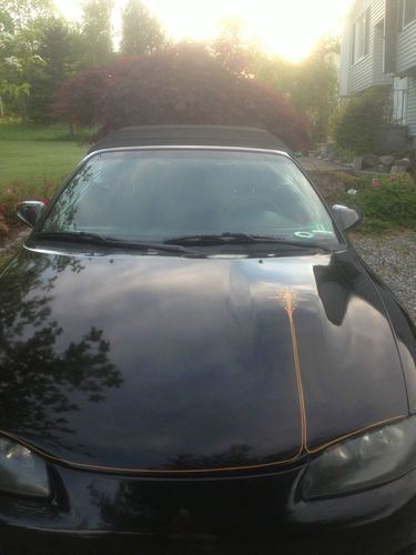 Black mitsubishi eclipse spider.  runs great,looks good. many new parts.must see
