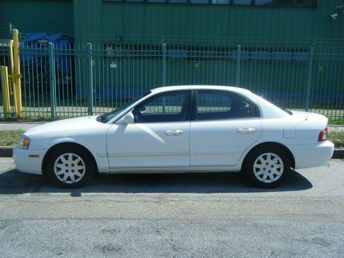 2004 kia optima and 2004 nissan quest se