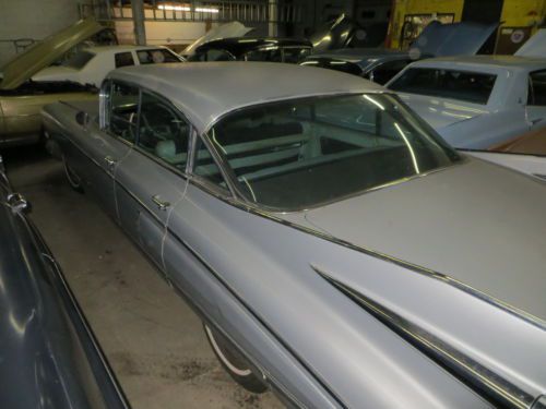 1959 cadillac  1960 eldorado hubcaps  may deliver  inspected sedan