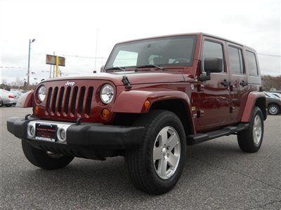 We finance! unlimited sahara 4x4 auto a/c hard and soft tops carfax certified!