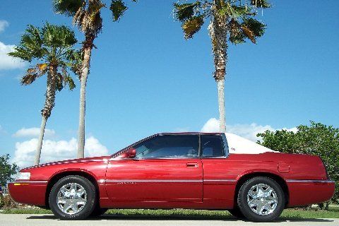 56,000 miles~crimson~chrome~carriage roof~abs~traction~gorgeous~00 01 02