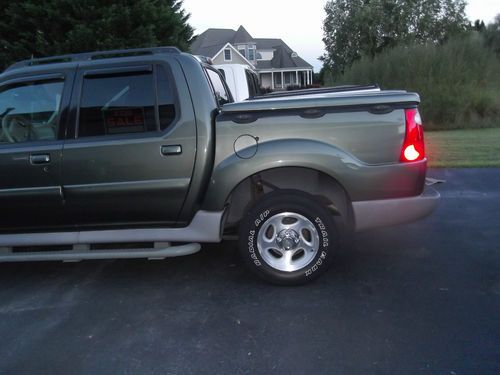 2002 army green ford explorer (sport trac)