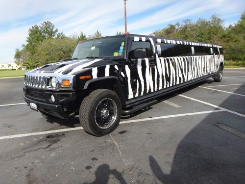 Unique zebra striped h2 hummer limo, eyecatching, great moneymaker.