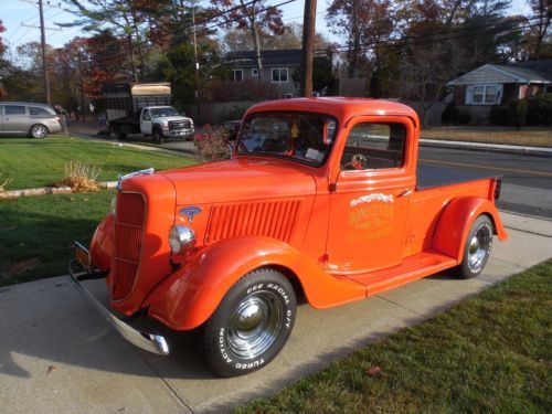 1936 orange ford pickup truck