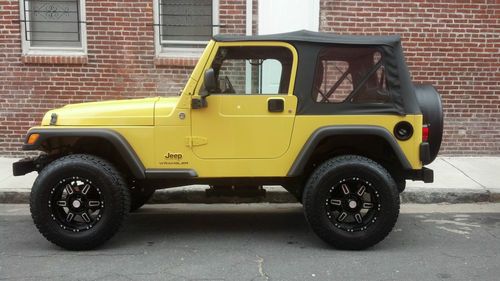 Low miles ready for summer 3'' lift yellow jeep