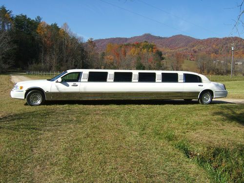 Lincoln limousine, white ultra, 180" stretch, 14 passenger