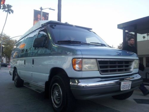 Awesome blue ford econoline campervan for travelling the world ;)