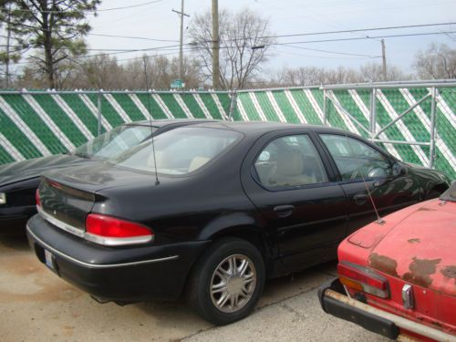 Black 4 door sedan with beige leather seats - has sunroof