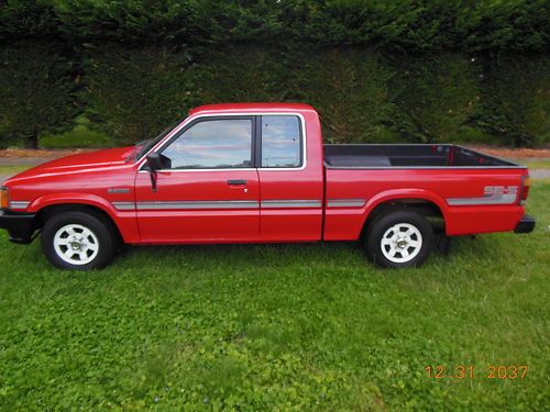 1987 mazda b2000 truck king cab red 82,699 actual miles 4 cylinder, 5 speed.
