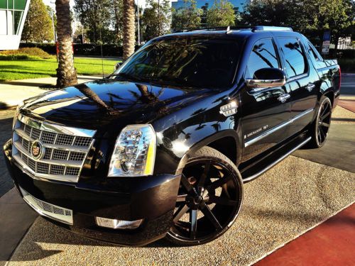 Cadillac escalade ext blacked out with 26 inch wheels