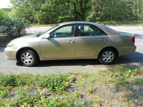 02 toyota camry le/x low low miles, runs and looks like new