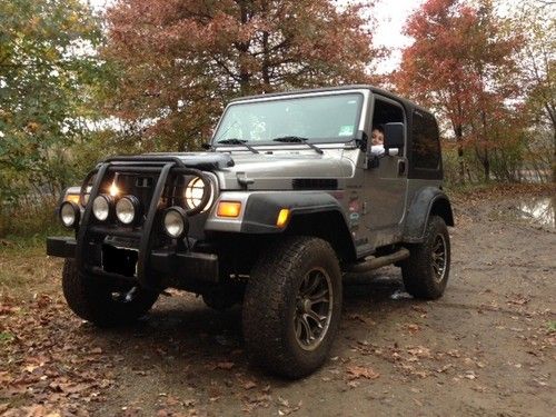 Jeep wrangler 2000 low millage,raised 33 tires, hard top, soft top.