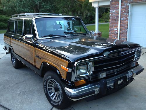 1991 black jeep grand cherokee with wood paneling