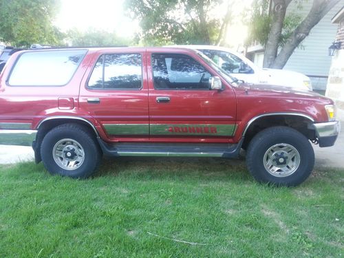 4 runner toyota, red 4 by 4. 6 cylinders. 1
