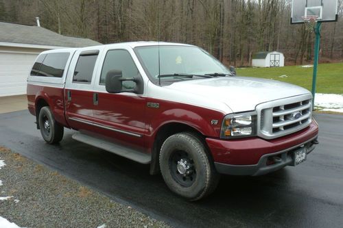 2000 f-250 super duty crew cab with leer cap  low miles on motor  no reserve