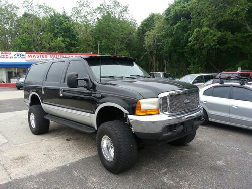 Black ford excursion   v10   35" tires  6" lift .....year '00