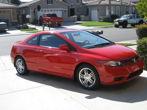 Red coupe with 47,800 miles, one owner.