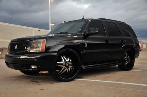 Cadillac escalade fully customized by unique autosports. blacked out, gucci