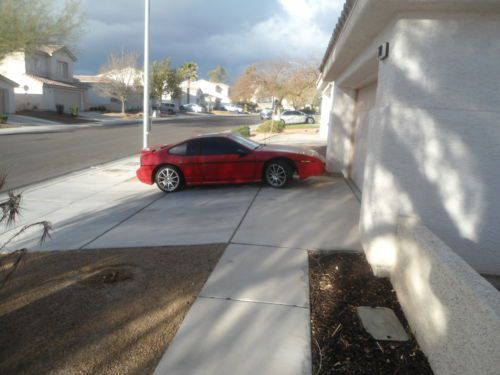 Classic bright red 1986gt pontiac fiero 2 seater scarce, stored well cared for