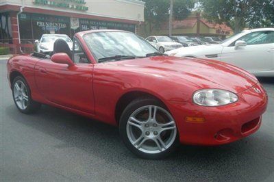 Florida n/c trade in, super low miles, very clean, bright red w/black leather!
