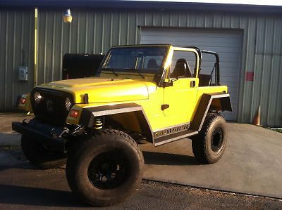 Lifted yellow jeep wrangler tj teraflex/clayton long arm 6&#034; suspension