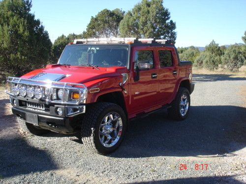 Red 2007 h2sut with 54,900 miles, completely customized, excellent condition
