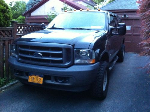 F250 black pick up truck 4x4 122,000 miles more or less