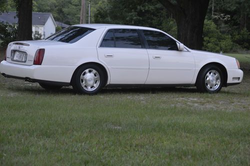 White cadillac deville.no damage to the car or what so ever.look classic