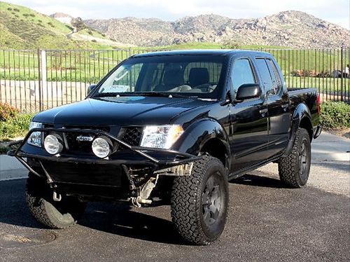 Lifted black nissan frontier crew cab 2005