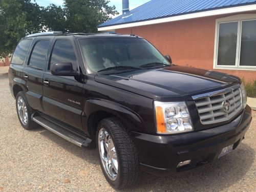 Beautiful black cadillac in mint condition with sunroof, dvd/tv, bluetooth, 22&#034;