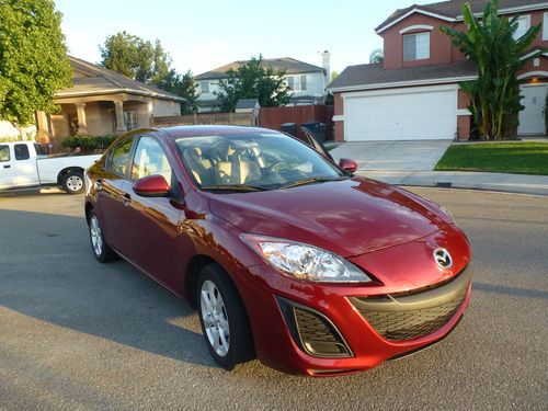 Red mazda 3 great condition, sunroof and bose stereo system