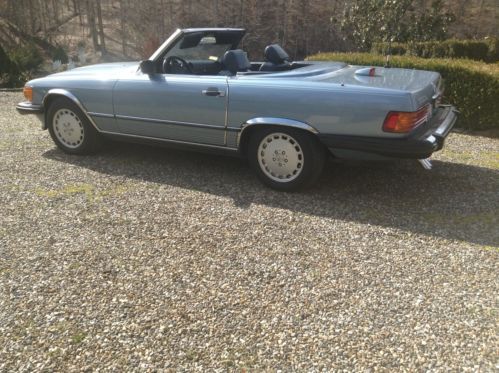 560 sl coupe/roadster.  diamond blue, blue leather upholstery.  hard &amp; soft top.