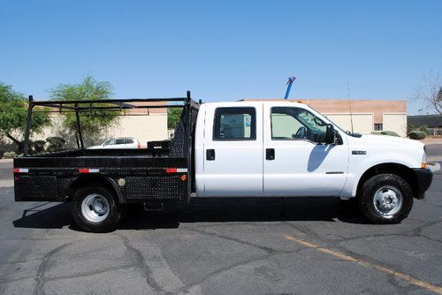 2002 f350 crew cab 4x4 with  7.3 powerstroke dually flatbed low mi rsrv $11,500