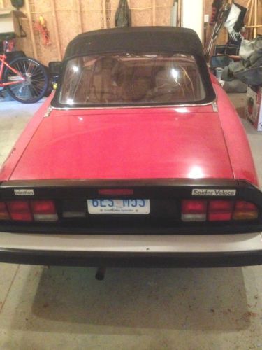 &#039;86 red, tan interior, (newer) black cloth top/rear window. ac/pw/pioneer st.