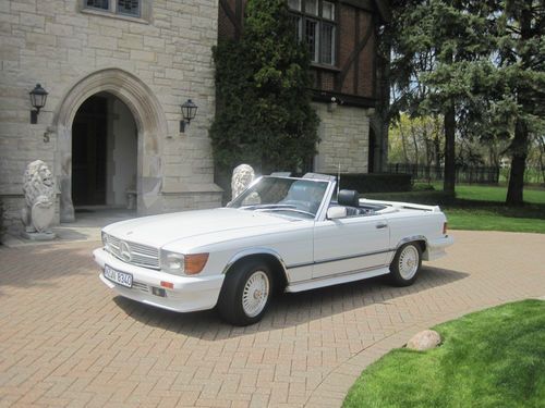 1987 mercedes benz 560sl convertible white with blue interior. 22k miles,1 owner