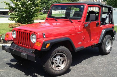 98 red jeep wrangler se 4 cyl 5 speed