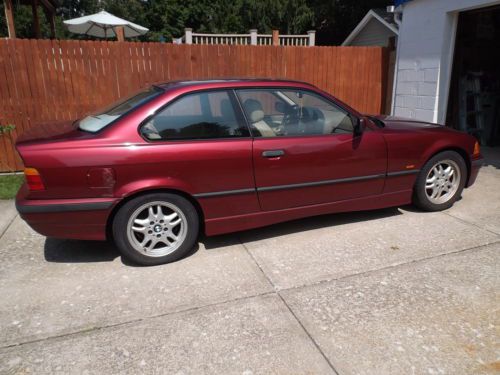 1997 bmw 328is maroon in color