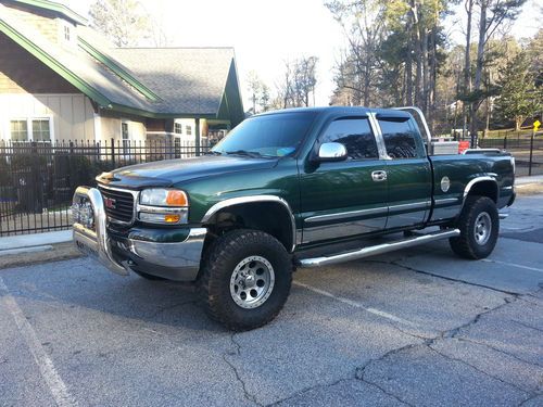Gmc sierra extended cab with fabtech 7.5 suspension lift kit / mt wheels