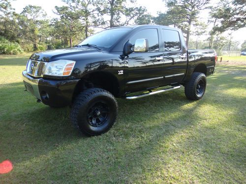 2004 nissan titan crew cab 4x4 lifted florida black beauty 1 own  v-8 force 5.6