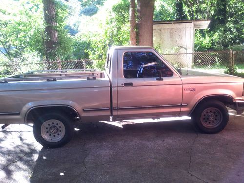 Brown two door 1990 ford  ranger in good condition a/c