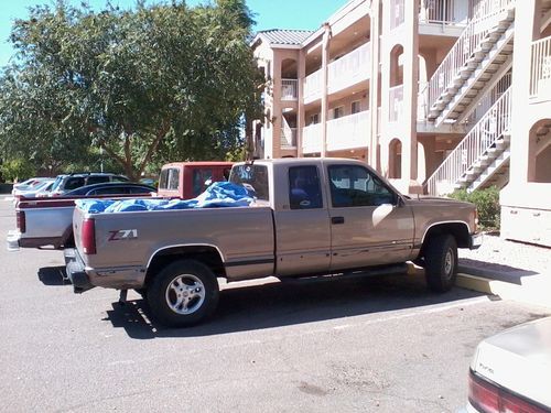 96 chevy 4x4 w/extended cab,5.7 vortec v8,at,ps,pb,ac,am/fm cd player