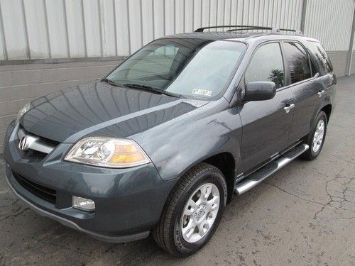 2006 acura mdx tourning with nav,4wd,leather,sun roof,back upcamera, we finance